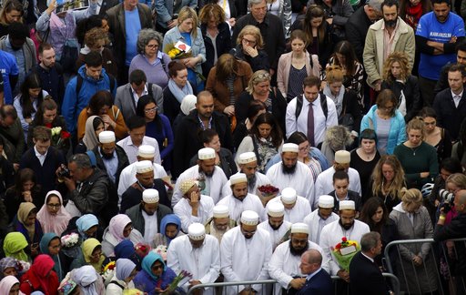 People attend a vigil for victims of Saturday's attack in London Bridge