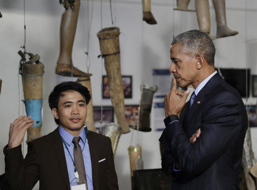 U.S. President Barack Obama tours the Cooperative Orthotic and Prosthetic Enterprise (COPE) Visitor Centre in Vientiane