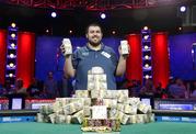 Scott Blumstein poses for photographers after winning the World Series of Poker main event
