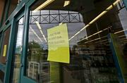 Signs posted at the entrance of a local Walgreens let possible customers know that the store remains closed Wednesday
