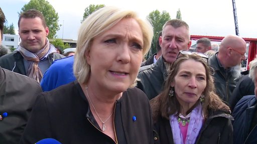 Far-right French presidential candidate Marine Le Pen is greeted by workers outside a whirlpool home appliance factory in Amiens