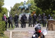 State Police in riot gear guard Lee Park after a white nationalist demonstration was declared illegal and the park was cleared in Charlottesville