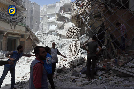 In this photo provided by the Syrian Civil Defense White Helmets