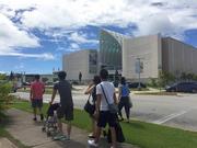 People walk around Hagatna