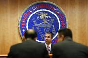 Federal Communications Commission (FCC) Chairman Ajit Pai takes his seat for an FCC meeting where they will vote on net neutrality