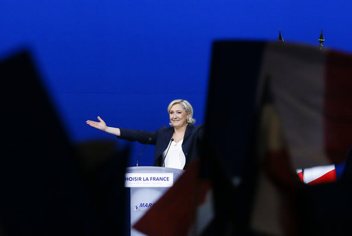 French far-right presidential candidate Marine Le Pen arrives at her meeting