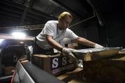 Volunteers prepare supplies for those affected by Hurricane Maria in the Roberto Clemente Coliseum in San Juan