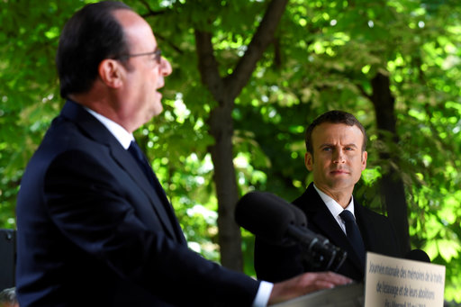 Outgoing French President Francois Hollande speaks as President-elect Emmanuel Macron