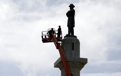 Workers prepare to take down the statue of Robert E. Lee