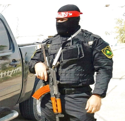 This undated photo obtained by the Associated Press shows an Iraqi bodyguard hired by Sallyport Global to protect VIPs. When a Toyota SUV was stolen from Balad air base