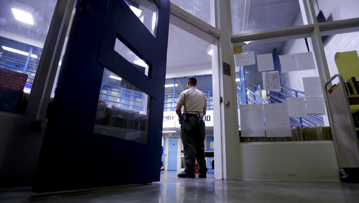 A Sheriff officer stands guard over inmates at the Twin Towers Correctional Facility Thursday