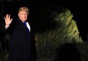President Donald Trump waves as he leaves the White House in Washington
