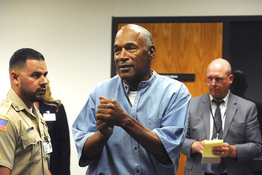 Former NFL football star O.J. Simpson reacts after learning he was granted parole at Lovelock Correctional Center in Lovelock