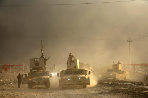 An Iraqi military convoy advances towards the city of Mosul