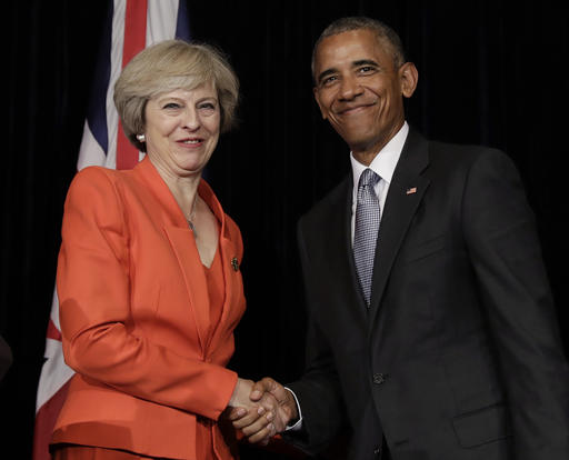 U.S. President Barack Obama and British Prime Minister Theresa May shake hands at the conclusion of a news conference after a bilateral meeting in Hangzhou in eastern China's Zhejiang province