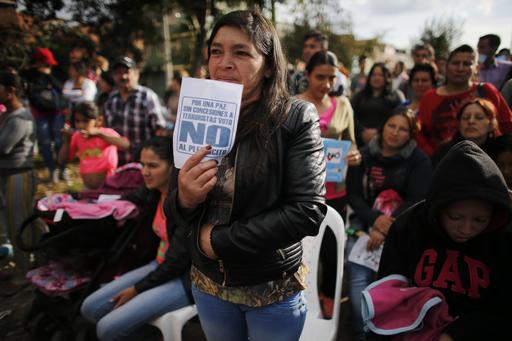 A woman attends an event to promote the "No" vote in the upcoming referendum on the peace deal signed between the Colombian government and rebels of the Revolutionary Armed Forces of Colombia
