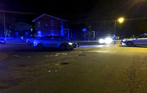 This image provided by the Virginia State Police shows law enforcement investigating the scene of a shooting early Saturday