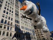 The Olaf balloon glides over Central Park West during the Macy's Thanksgiving Day Parade in New York