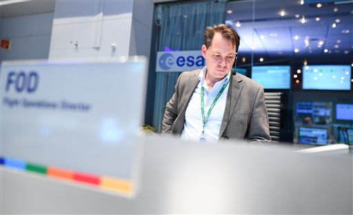 An employee stands in the control center  of the European Space Agency (ESA) in Darmstadt