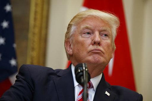 President Donald Trump listens as Turkish President Recep Tayyip Erdogan speaks in the Roosevelt Room of the White House in Washington