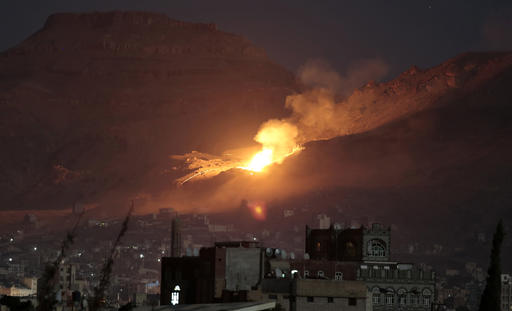Fire and smoke rise after a Saudi-led airstrike hit a site believed to be one of the largest weapons depots on the outskirts of Yemen's capital