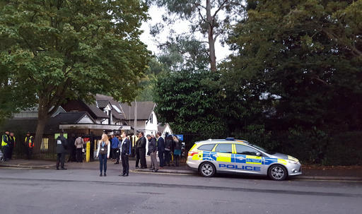 Police and evacuated visitors stand outside London Zoo after a gorilla escaped in London