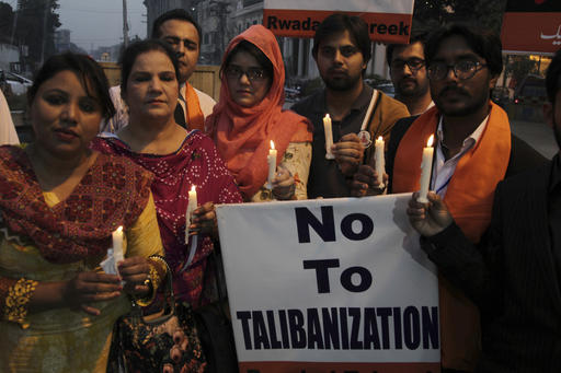 People attend a candlelight vigil for the victims of an overnight attack on the Quetta Police Training Academy