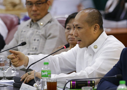 Rep. Gary Alejano gestures as he tries to defend the impeachment complaint he filed against Philippine President Rodrigo Duterte during a Justice Committee hearing at the House of Representatives in metropolitan Manila
