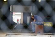 A worker sits inside the New Orleans Sewerage & Water Board Facility