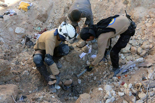 In this photo provided by the Syrian Civil Defense group known as the White Helmets
