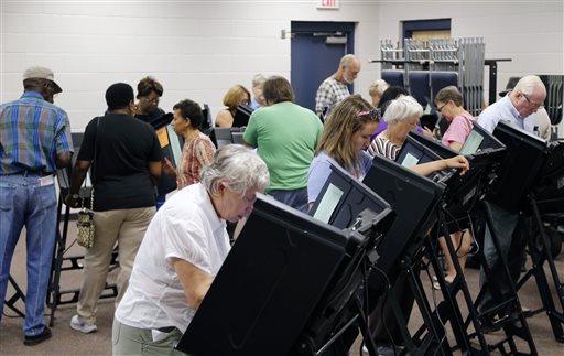 Voters fill the stations as hundreds came out on the first day of early voting at the Hope Mills Recreation Center in Hope Mills