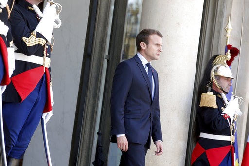 France's President Emmanuel Macron arrives to welcome his Peruvian counterpart Pedro Pablo Kuczynski