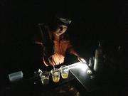 Downtown Houston bar owner William Bedner pours a round of whiskeys by flashlight in this photo taken on Aug. 28