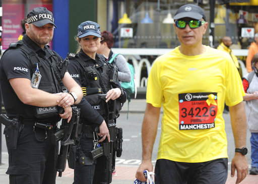 Armed response police guard the scene at the Great Manchester Run in central Manchester