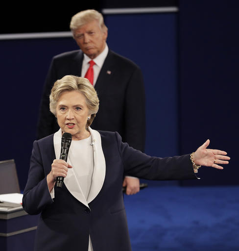Republican presidential nominee Donald Trump listens to Democratic presidential nominee Hillary Clinton during the second presidential debate at Washington University in St. Louis