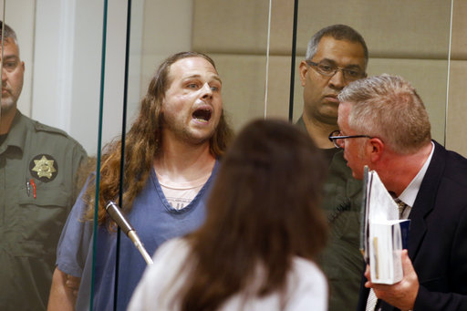 Jeremy Joseph Christian shouts as he is arraigned in Multnomah County Circuit Court in Portland