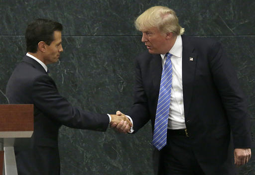 Mexico President Enrique Pena Nieto and Republican presidential nominee Donald Trump shake hands after a joint statement at Los Pinos