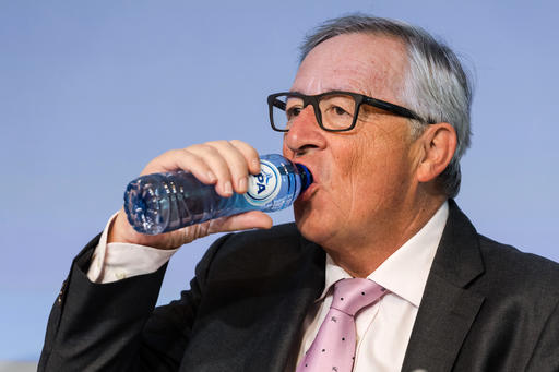 European Commission President Jean-Claude Juncker drinks water as he attends a plenary session of European Economic and Social Committee at the EU Charlemagne building in Brussels Thursday