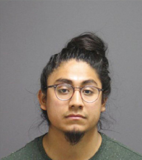 This undated photo provided by UConn Police Department via the Hartford Courant shows Eric Cruz-Lopez. Cruz was charged on May 7