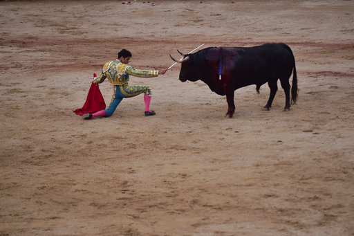 Spanish bullfighter Gayetano challenges a Jandilla ranch bull during a bullfight at the San Fermin festival in Pamplona
