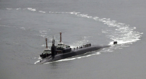 The nuclear-powered submarine USS Michigan approaches to join the U.S. aircraft carrier USS Carl Vinson in drills near the Korean Peninsula