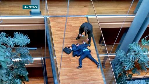 British UK Independence Party Member of the European Parliament Steven Woolfe lies on the ground  after losing consciousness in the European Parliament building in Strasbourg France Thursday Oct. 6