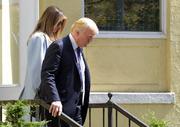 President Donald Trump and first lady Melania Trump leave after attending services at St. John's Church in Washington