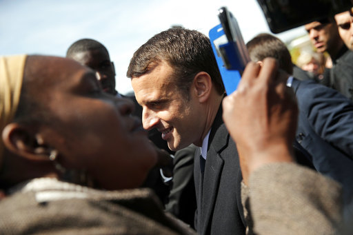 French President-elect Emmanuel Macron poses with supporters after a ceremony commemorating the abolition of slavery