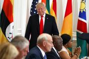 President Donald Trump walks to his seat after speaking during a luncheon with African leaders at the Palace Hotel during the United Nations General Assembly