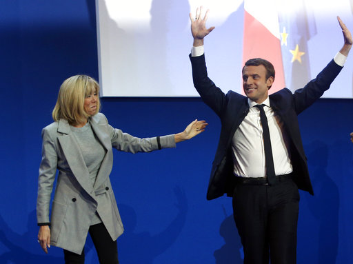 French centrist presidential candidate Emmanuel Macron and his wife Brigitte arrives to address his supporters at his election day headquarters in Paris