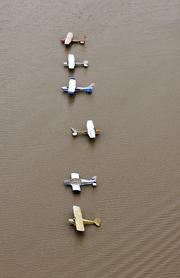 Airplanes sit at a flooded airport near the Addicks Reservoir as floodwaters from Tropical Storm Harvey rise Tuesday