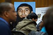 A photo of Sayfullo Saipov is displayed at a news conference at One Police Plaza Wednesday