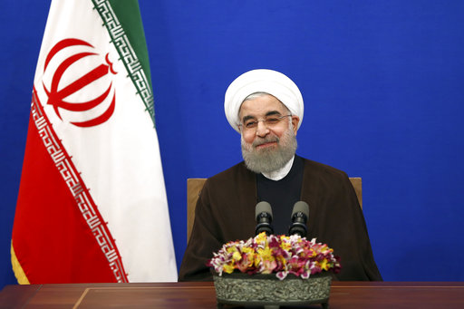 Iranian President Hassan Rouhani attends a televised speech after he won the election