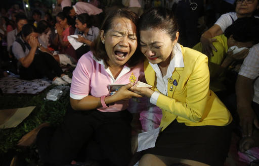 Thais cry outside Siriraj Hospital where King Bhumibol Adulyadej was treated in Bangkok